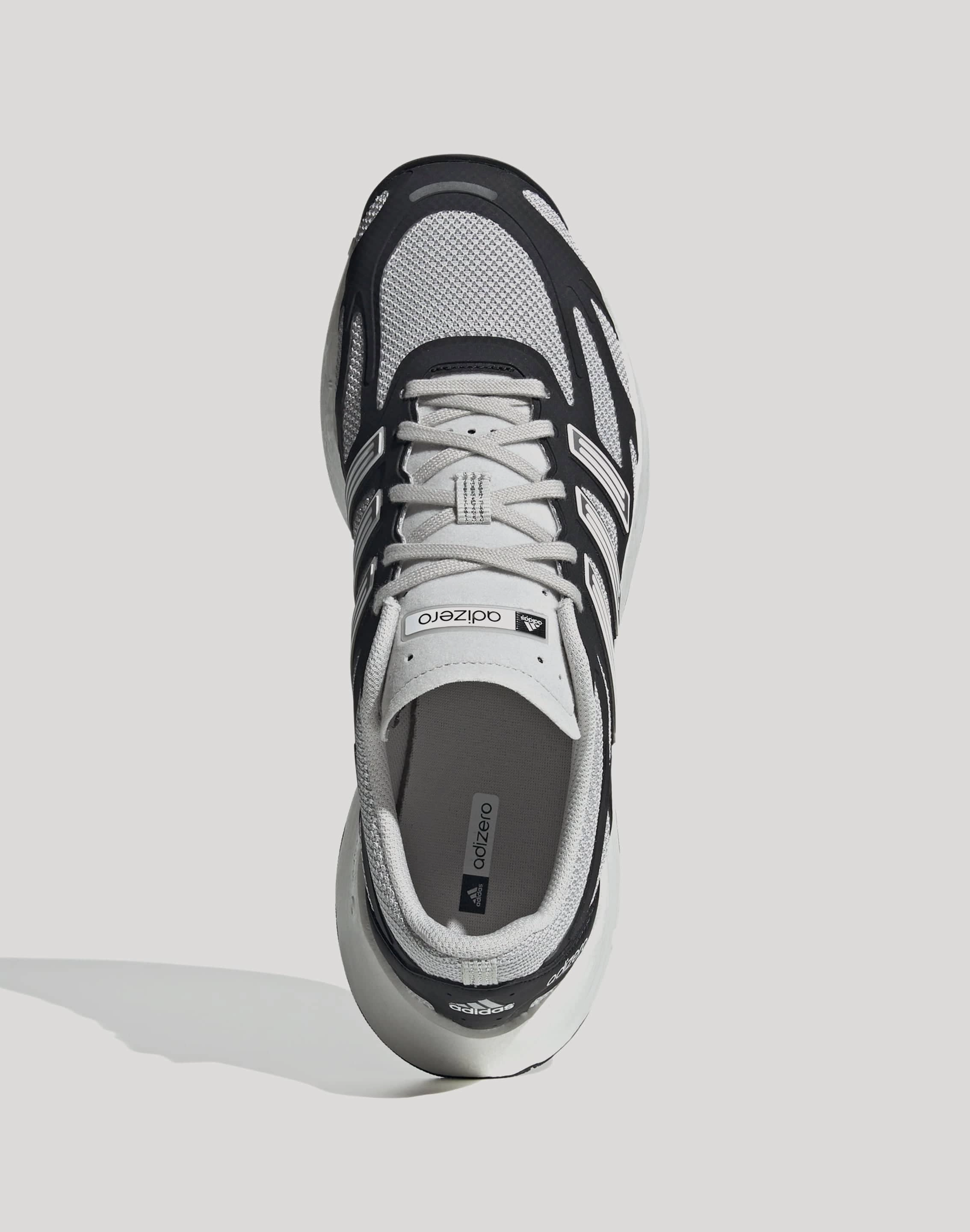 Adidas Adizero Aruku "Black/Grey One" Micro Adjust Straps running in a sidewalk area shoes