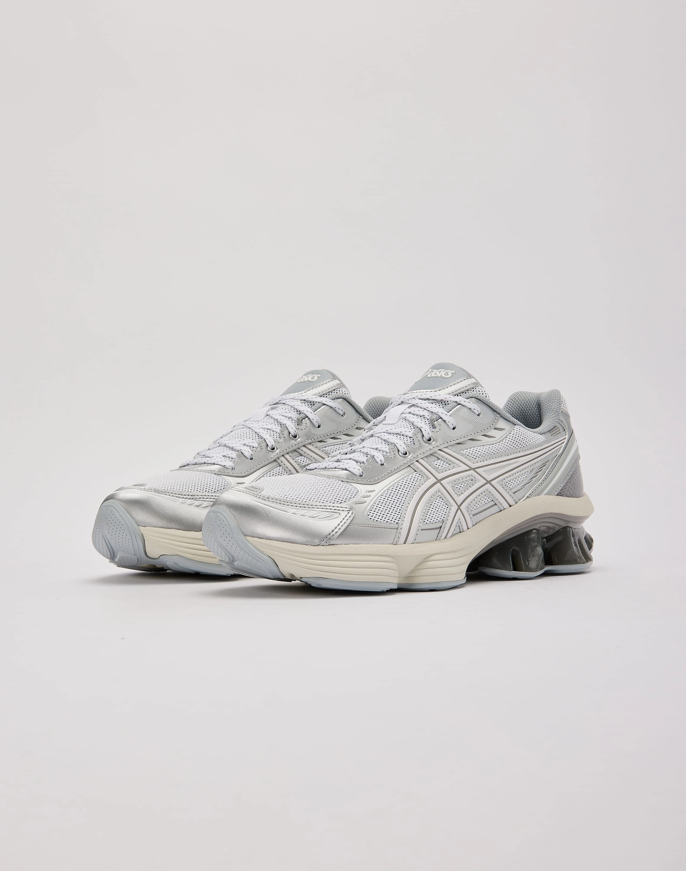 muted - colored running shoes running with a watch Asics GEL-KINETIC FLUENT